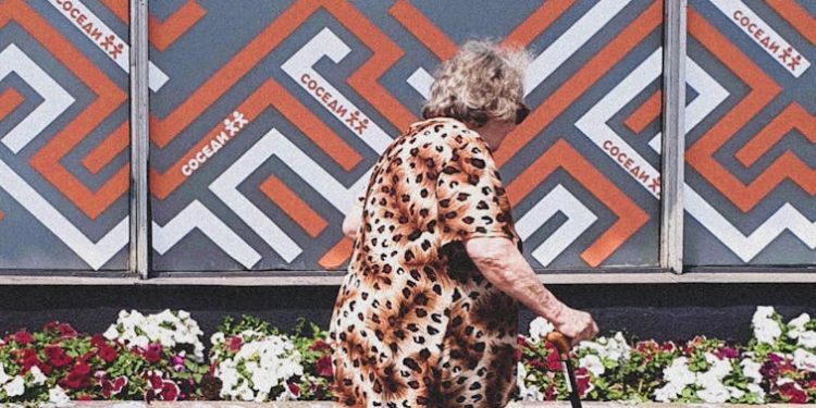 Elderly Woman Walking her Dog