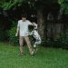 Man Playing with His Dalmatian Dog in the Backyard 